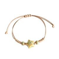 Bracelet de couple en céramique colorée en forme d'étoile de mer, bracelet en corde tressée de couleur café, perles en céramique, cadeau pour homme et femme