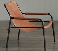 Fauteuil lounge en cuir pleine fleur tanné végétal, design danois moderne, pour projet hôtelier 5 étoiles, idéal pour salon.