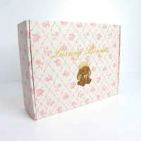 Boîte d'expédition en carton ondulé rose de haute qualité pour emballage cadeau, avec gaufrage et structure robuste pour bonnets de luxe