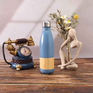 Bouteille d'eau isotherme en acier inoxydable avec base en bambou, design rond, pour les voyages, style minimaliste - Product Image 2