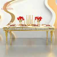 Table de banquet rectangulaire moderne de luxe en acier inoxydable doré en forme de S avec plateau en verre cristal pour événements de mariage