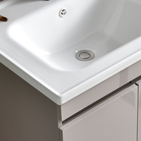 Ensemble de meubles de salle de bain minimaliste et écologique avec lavabo en céramique, design mural, caractéristiques résistantes à l'eau pour appartement et école