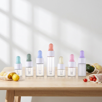 Botol Tetes Kaca Bening Bulat Kecil 15ml untuk Sampel Minyak Atsiri dengan Ujung Berlapis Emas dan Cincin Ujung Berwarna