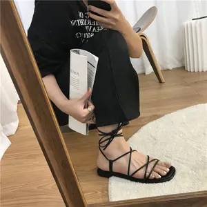 Dropshipping Sandalias romanas con logotipo personalizado para mujer, zapatos planos informales de gladiador de playa con cordones y Punta abierta de talla grande a la moda para mujer