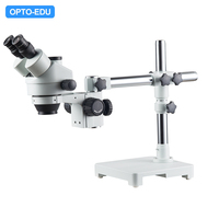 Microscope stéréoscopique zoom binoculaire OPTO-EDU A23.3645-STL1 7x-45x avec support de bras 0.7x-4.5x pour l'électronique et les circuits imprimés