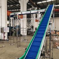 Transportador de Cadena Modular de Cangilones Independientes para Elevación Suave de Productos en Líneas de Procesamiento de Snacks