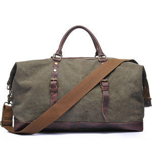 กระเป๋าเดินทางแบบถือขึ้นเครื่องรุ่น G-Favor 2077 ขนาดใหญ่ สำหรับแคมป์ปิ้ง กีฬา ฟิตเนส พักค้างคืน ท่องเที่ยว  พร้อมโลโก้สั่งทำพิเศษ  กระเป๋าผ้าแคนวาสสไตล์วินเทจสำหรับผู้ชาย - Product Image 1