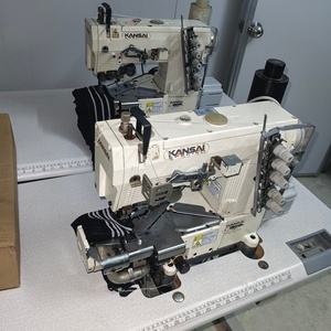 Machine à coudre à point de recouvrement d'occasion fabriquée au Japon avec moteur pour usage domestique - Product Image 1