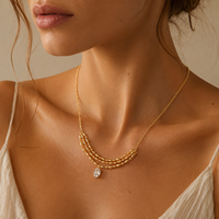 Collier ras du cou tendance en chaîne à maillons multicouches plaqué or avec perles de riz et pendentif ovale en zircon transparent, style luxe léger