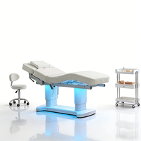 Table et lit de massage professionnels pour salon de beauté, mobilier moderne de luxe, 4 moteurs, base blanche, lit de spa électrique pour soins du visage avec éclairage