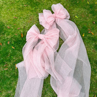 Grand nœud en organza rose de luxe pour la décoration visuelle des vitrines et des événements