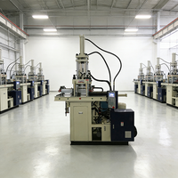 Machine de moulage à insertion verticale à table coulissante pour la production de boîtiers de capteurs et de connecteurs