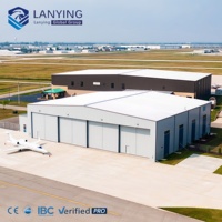 Hangar en structure acier préfabriquée de qualité supérieure avec fenêtres en alliage d'aluminium et porte roulante pour le stockage d'avions privés