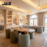 Ensemble table et chaises de restaurant J2S Hotel Design, sièges rembourrés en forme de baril, surface en bois ovale, solutions modernes pour les usines.