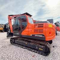 Excavadora de cadenas usada Doosan DX140LCA de alto rendimiento y bajo costo con tren de rodaje estable para proyectos de construcción en carreteras y limpieza de terrenos