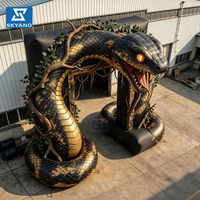 Arche gonflable série Serpent, modèle publicitaire gonflable en forme de python noir et or, design tridimensionnel