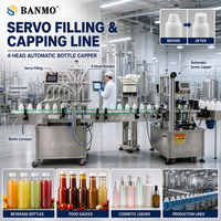 Machine de remplissage et de bouchage automatique de liquides BANMO à 4 têtes, système de convoyage, ligne d'emballage en acier inoxydable