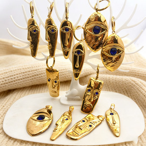 Boucles d'oreilles tendance YWXS Fashion en acier inoxydable 18 carats, pendentif géométrique de luxe en acier inoxydable avec œil bleu et visage humain pour femme - Product Image 1