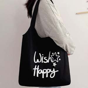 กระเป๋าผ้าแคนวาสแบบเรียบง่ายรักษ์โลกพร้อมหูหิ้วเชือก ใช้ซ้ำได้สำหรับการเดินทางและพิมพ์ลายตัวอักษร - Product Image 2