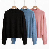 Pull en maille uni noir à col montant pour femme, avec épaules tombantes et manches longues à revers côtelés, coupe décontractée et décontracté