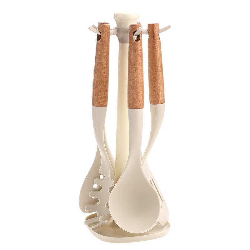 Ensemble d'ustensiles de cuisine 6 pièces avec manche en bois blanc et support rotatif.
