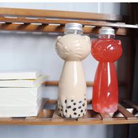 Bouteille de boisson en forme de chat en plastique jetable PET de 500ML nouveau type avec bouchon à vis en aluminium pour jus Soda café thé