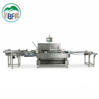 Système de mise en carton en ligne pour le chargement de flacons de répulsif anti-moustiques électriques et la sortie en carton