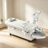Robot de massage à 2 bras avec IA, table et manette de contrôle, capable de massage automatique multi-zones pour centres de spa et hôtels haut de gamme