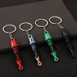 Porte-clés en gros en forme d'amortisseur de <span class=keywords><strong>voiture</strong></span>, breloque pour sac à dos, cadeau unique pour hommes et femmes, porte-clés style modification automobile - Product Image 1