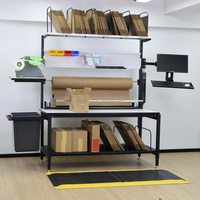 Table d'emballage robuste en acier, hauteur réglable, plan de travail avec convoyeur à rouleaux, capacité de 500 kg, certifiée ISO 9001