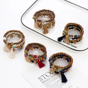 Direktverkauf des Herstellers bohème-Stil mehrschichtiger Holzbaum-Anhänger elastische Perlen-Stapel-Armbänder