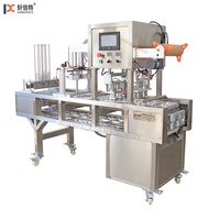 Machine automatique de cachetage de tasse de yaourt et de jus de petite taille Machine de conditionnement multifonctionnelle de tasse en plastique pour des usines