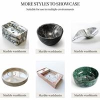 Meuble-lavabo mural double vasque de luxe, moderne et avant-gardiste, en marbre Nero Marquina, pour salles de bain d'hôtels cinq étoiles et chambres exécutives