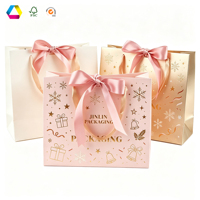 Sac cadeau en papier spécial recyclable personnalisé avec longue poignée, sac fourre-tout de luxe avec nœud en ruban pour l'emballage de cadeaux de festival