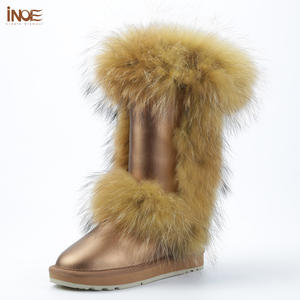 Botas de nieve de invierno OEM a la moda <span class=keywords><strong>para</strong></span> mujer, piel de vaca auténtica con forro de felpa sintética de mapache, planos impermeables antideslizantes - Product Image 1