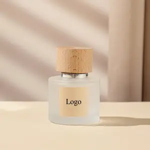 Botella de perfume de cristal al por mayor diseño transparente esmerilado redondo en 30ml 50ml