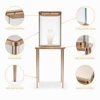Vitrine à bijoux sur mesure en or rose avec vitrine en verre pour boutique de bijoux de marque, distributeur et design d'intérieur