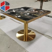 Plateaux de table à manger modernes en marbre noir carré, directement de l'usine, avec base de table dorée