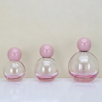 Vente en gros d'usine - Flacon de parfum sphérique en verre coloré de 30 ml, 50 ml, 100 ml, flacon pulvérisateur portable de type pression avec bouchon à bille