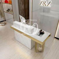 Table de comptoir en marbre blanc au Design créatif moderne, bureau de réception de Salon de beauté en or