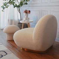 Chaise longue de forme unique avec corps en coton moulé et base en métal noir mat