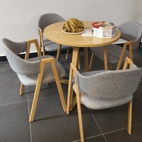 Petite table à manger ronde moderne minimaliste, ensemble de 4 chaises