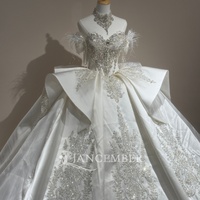Robe de mariée de bal en satin ivoire Xs327 Regal Sweetheart avec plumes, cristaux, pompons et volants origami Jancember