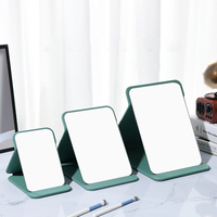 Miroir de poche pliant en cuir PU avec logo personnalisé Miroir de courtoisie de voyage portable avec support pour table de bureau Miroir de maquillage