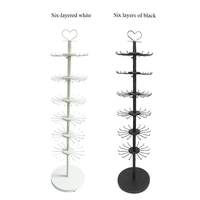 Présentoir rotatif à six niveaux noir et blanc pour porte-clés et jouets, réglable en hauteur, en MDF et acier, facile à nettoyer