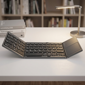 โปรโมชั่นใหม่มาแรง คีย์บอร์ดพับได้พกพาสะดวก คีย์บอร์ดไร้สายแบบพับได้ Qwerty พร้อมทัชแพดสำหรับสมาร์ทโฟนและแท็บเล็ต - Product Image 1