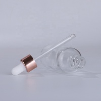 Sérum classique en gros 30 ml flacon compte-gouttes en verre transparent avec couvercle en or rose pour huile essentielle