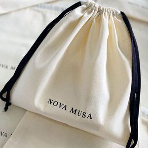 Low Price Eco Friendly Cheap Natural <b>Drawstring</b> Gift Cotton <b>Pouch</b> Promotional Calico Cloth Packaging Bag With Black Ribbon - Product Image 1