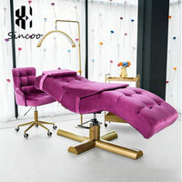 Lit de massage en velours d'acier inoxydable rose pour spa facial et extensions de cils, vente en gros directe usine à prix abordable