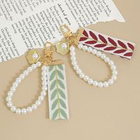Porte-clés lumineux, cordon pour téléphone, design feuille, pendentif en perle, écouteurs, décoration de fête d'anniversaire, cadeau